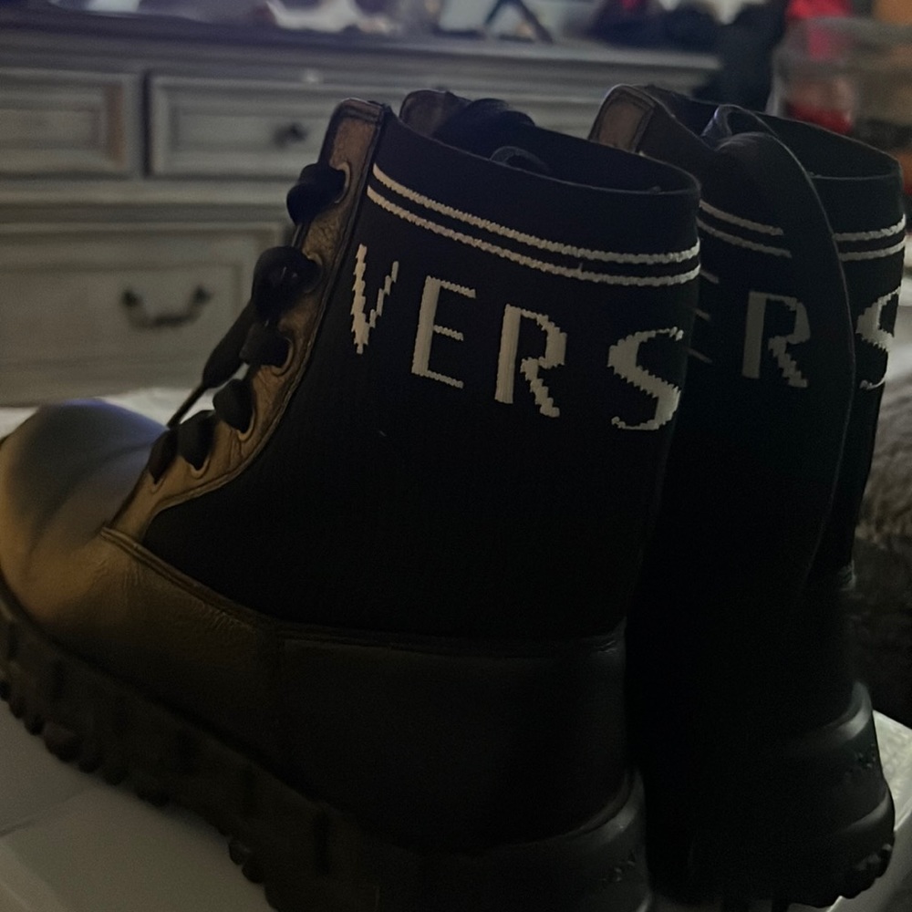 Women’s Versace boots worn once in excellent condition.Size 7 black leather.